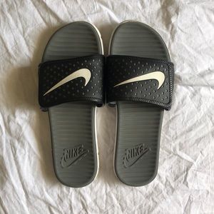 Grey and black nike slides